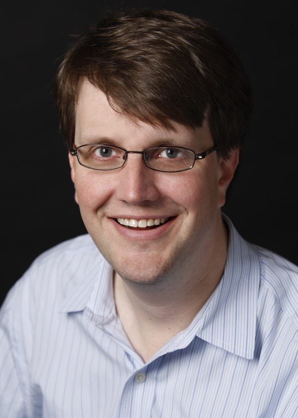 Gregersen smiles in a corporate photo. 