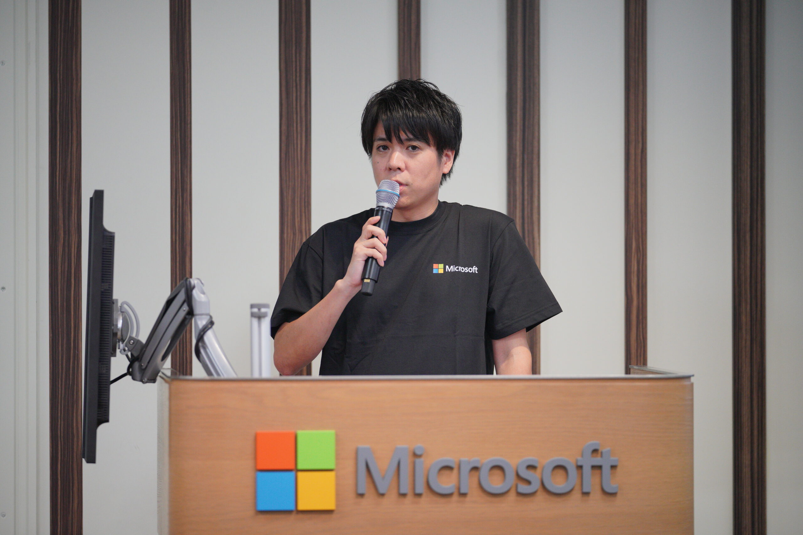 A man speaking into a microphone