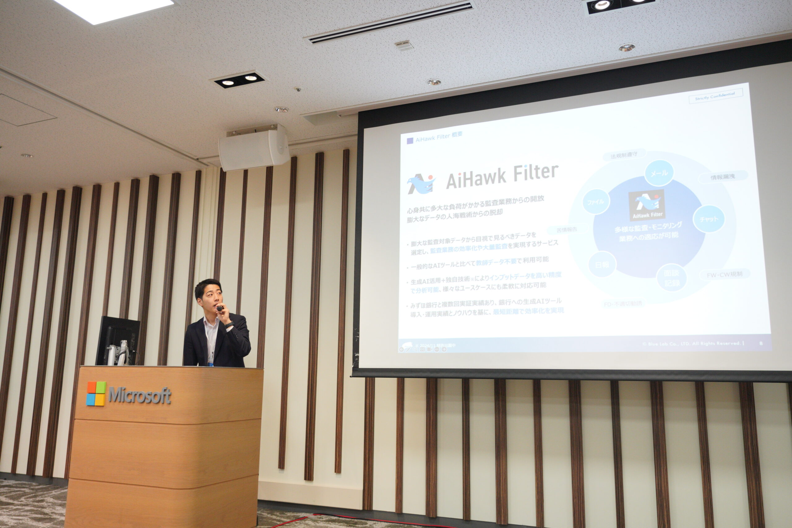 A man standing at a podium speaking into a microphone