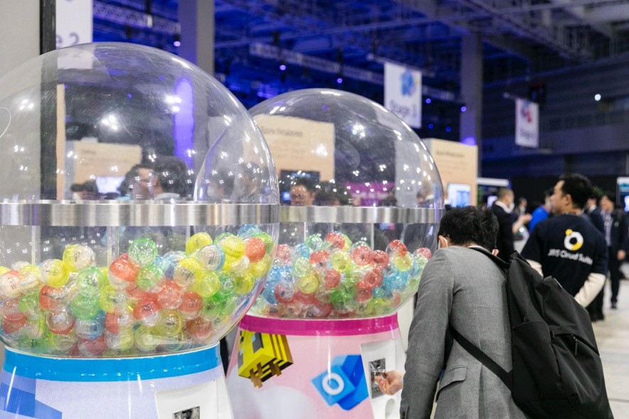 A group of people standing next to a machine