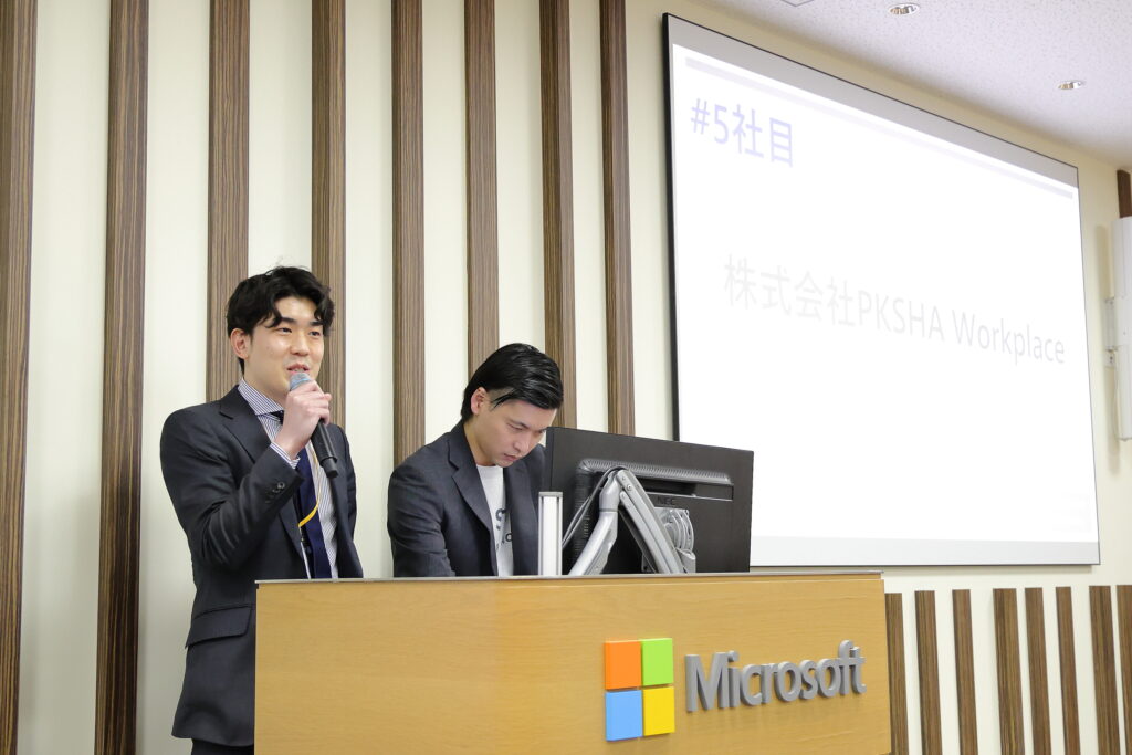 A man standing behind a podium with a microphone
