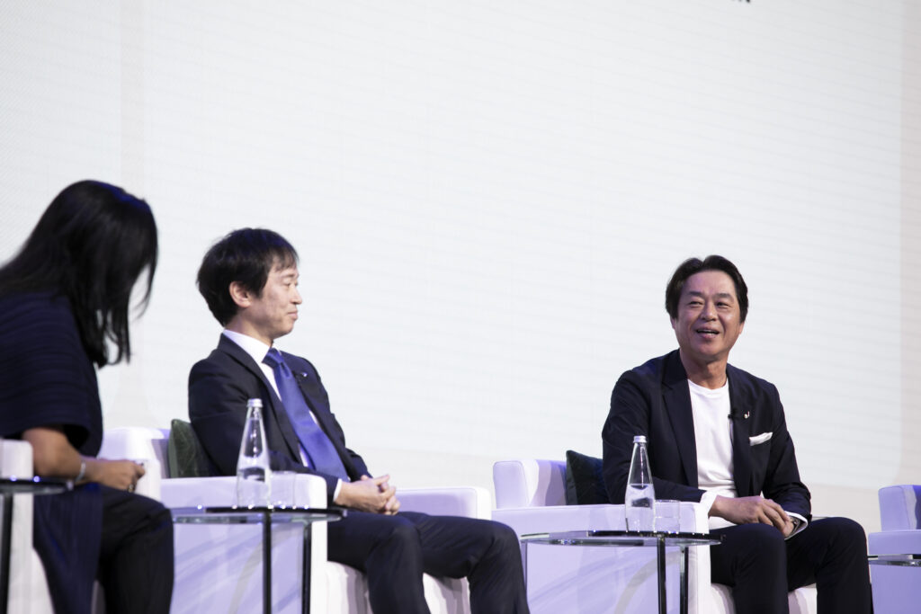 A group of men sitting on chairs