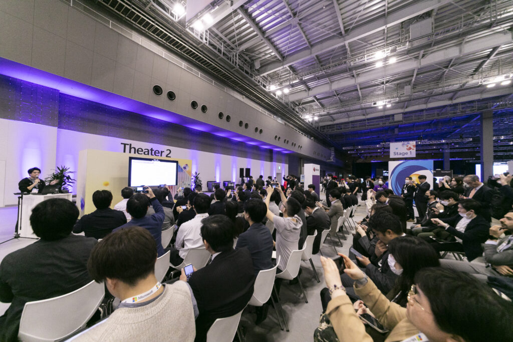 A group of people sitting in chairs in a room