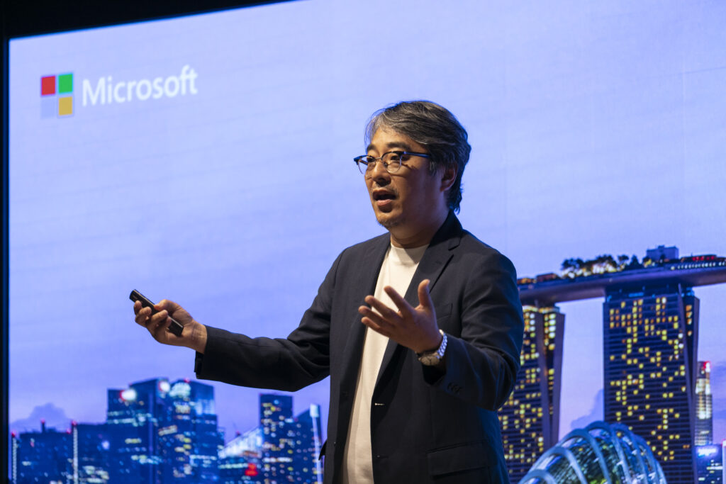 A man in a suit holding a phone