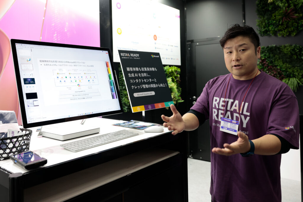 A man standing in front of a computer